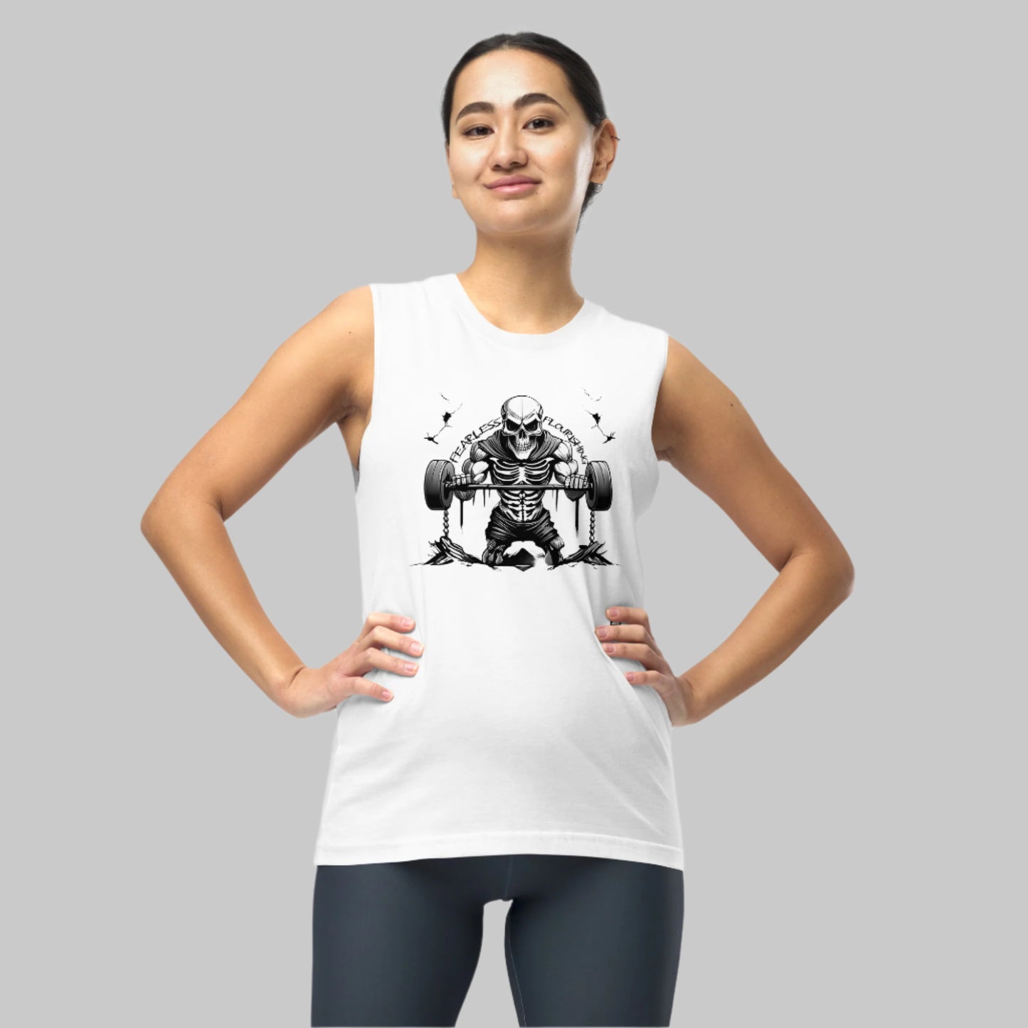 Front of Woman wearing Undead Gym Tank in White, Skull Skeleton lifting weights design, text Fearless Flourishing in black.