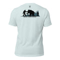 Men’s heather prism ice blue prehistoric hunting shirt showing mammoth hunter and Bigfoot Ancient Knows Ancient artwork