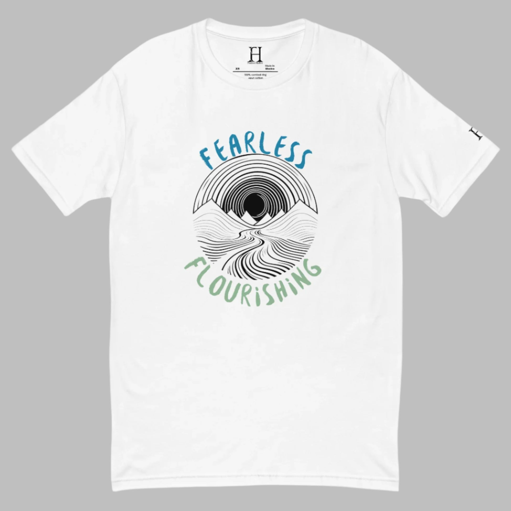 Front of white T-shirt with black outline of a river flowing through mountains and the words Fearless and Flourishing.