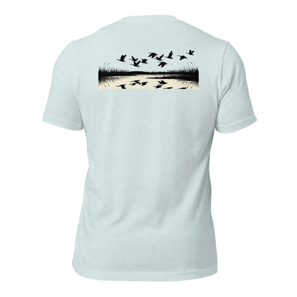 Men's Drift Line Goose Tee in Heather Prism Ice Blue showing geese drifting across marsh grass with mirrored waterline