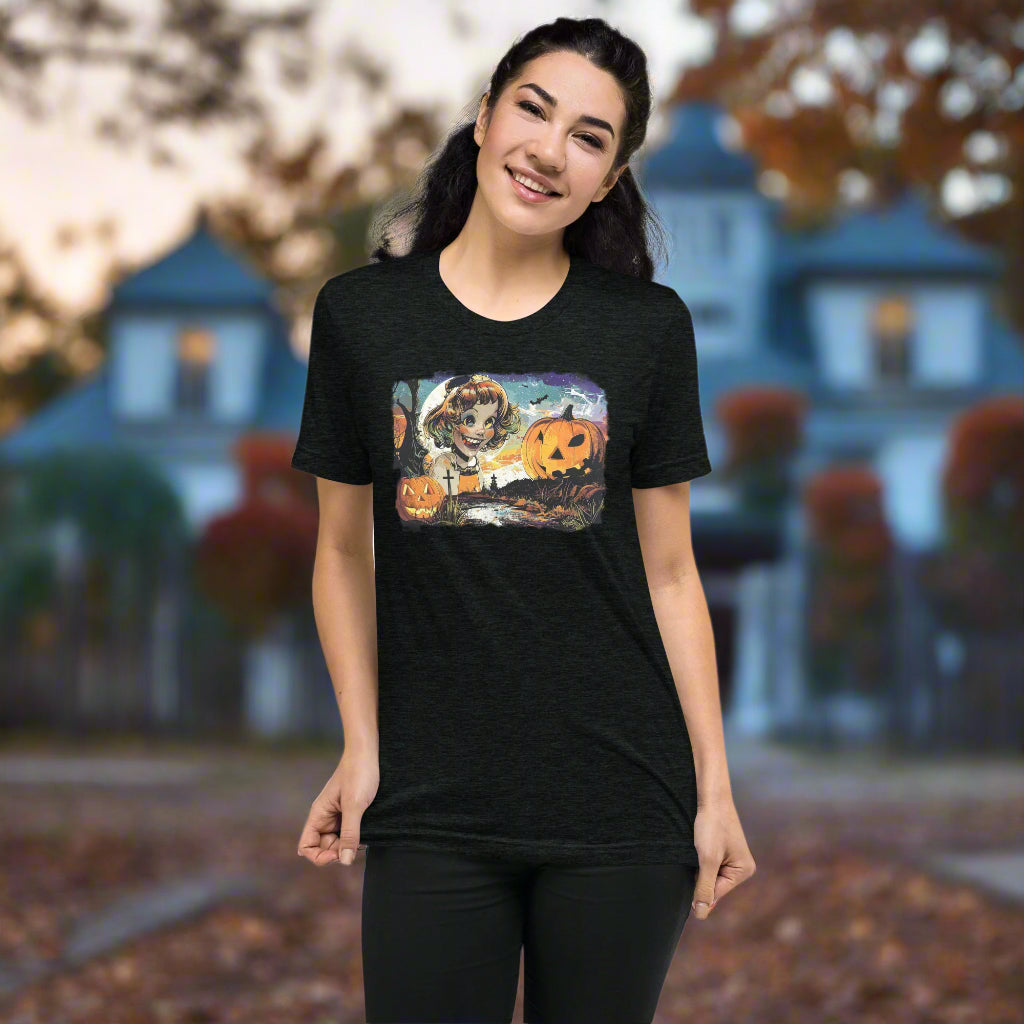 Front view of woman wearing Crazed Moonlit Muse Tee in Charcoal Black, featuring vintage haunted creepy smile design for Halloween.