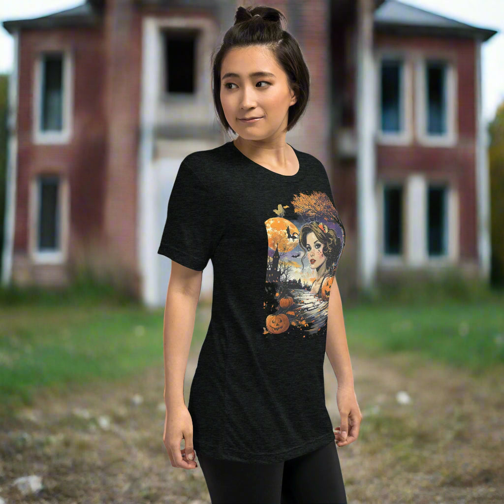 Front view of woman wearing Shadowed Siren Glow Tee in charcoal black, featuring vintage haunted glowing siren design for Halloween.